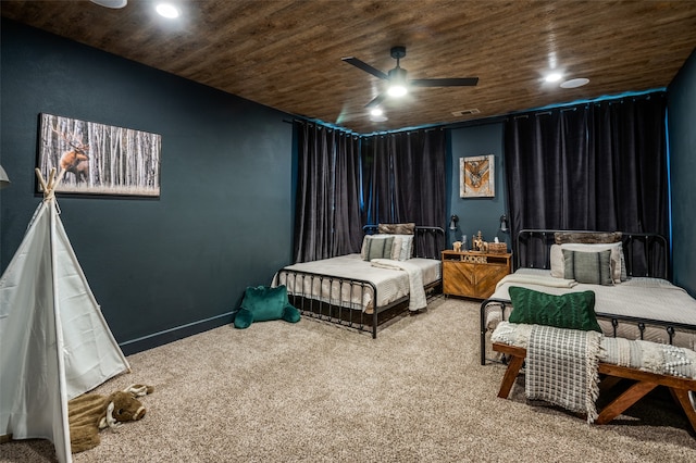 bedroom featuring ceiling fan, wooden ceiling, and carpet