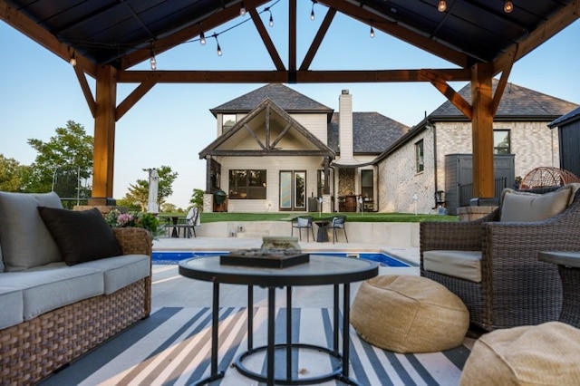 view of patio featuring outdoor lounge area and a gazebo