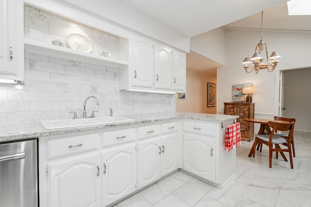 kitchen featuring marble finish floor, white cabinets, a sink, and stainless steel dishwasher