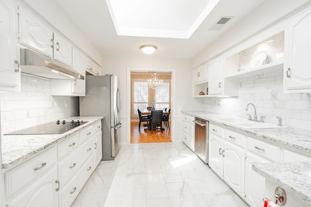 kitchen with under cabinet range hood, a sink, marble finish floor, appliances with stainless steel finishes, and open shelves