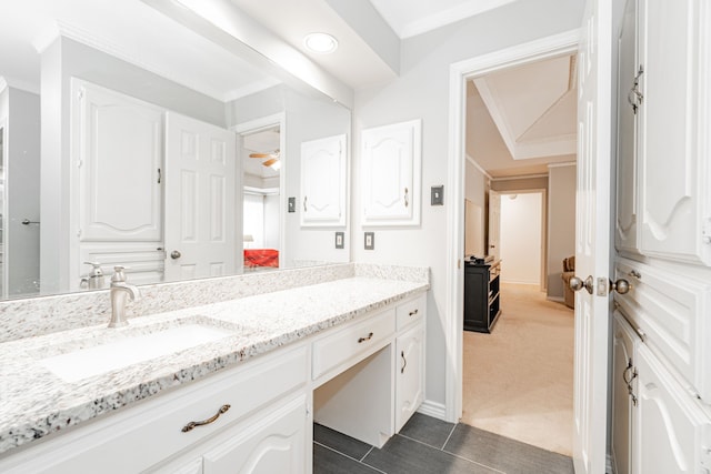 bathroom featuring tile patterned floors, ceiling fan, crown molding, and vanity