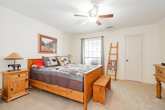 bedroom with light colored carpet, ceiling fan, and crown molding