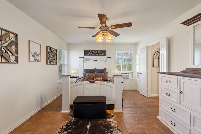 bedroom featuring dark tile patterned flooring and ceiling fan