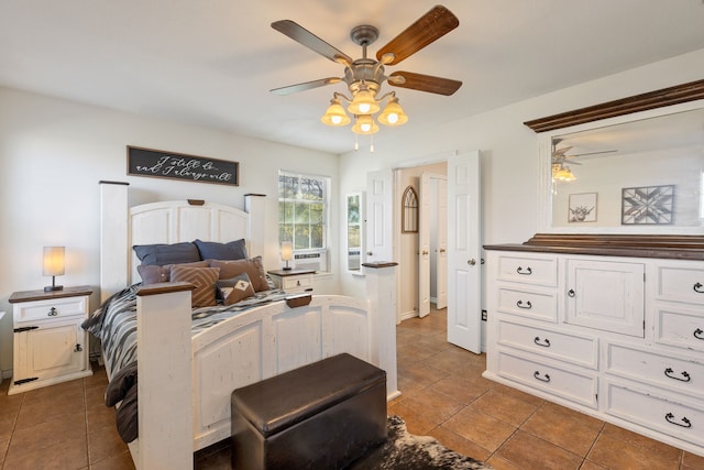 tiled bedroom featuring ceiling fan