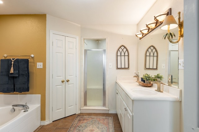 bathroom featuring tile patterned floors, vanity, and independent shower and bath