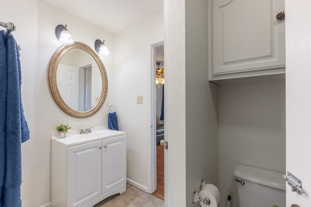 bathroom with vanity and toilet