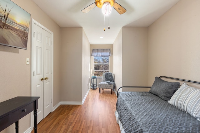 interior space with ceiling fan and wood-type flooring