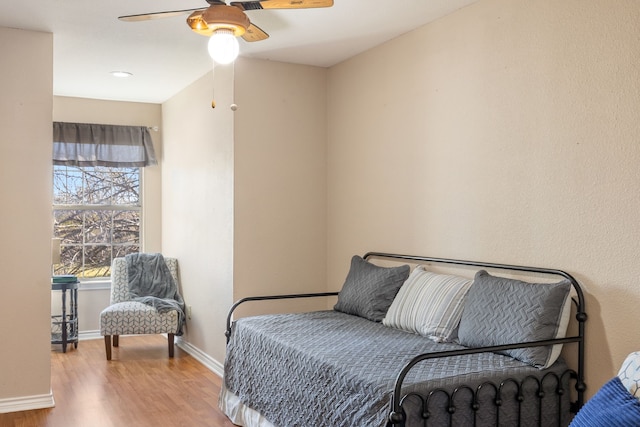 interior space with ceiling fan and light hardwood / wood-style floors