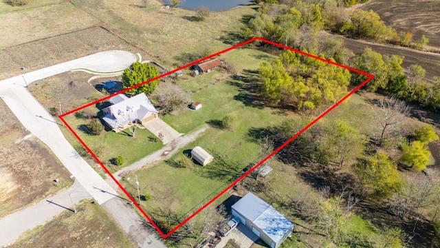 birds eye view of property featuring a rural view