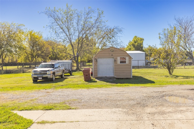 garage featuring a yard