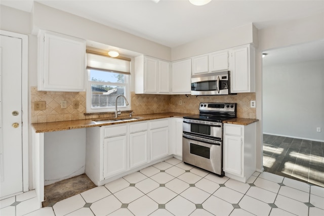 kitchen featuring white cabinetry, sink, and stainless steel appliances