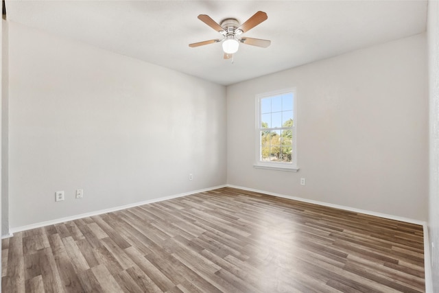 unfurnished room featuring ceiling fan and hardwood / wood-style flooring