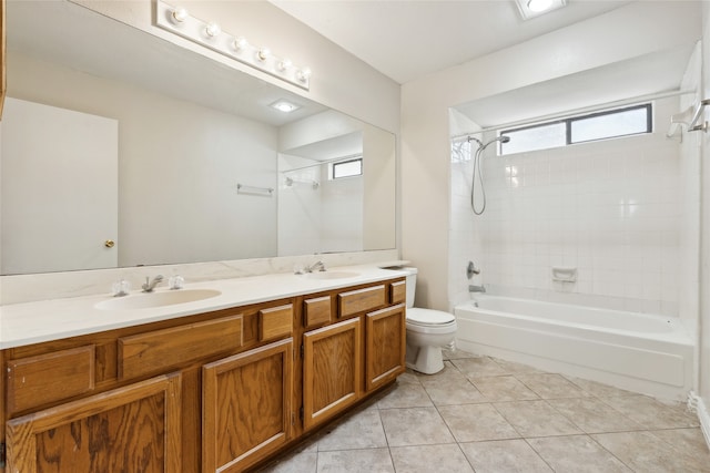 full bathroom featuring tile patterned floors, vanity, toilet, and tiled shower / bath