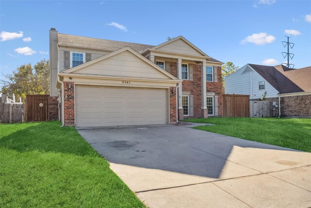 view of front of house with a garage and a front lawn