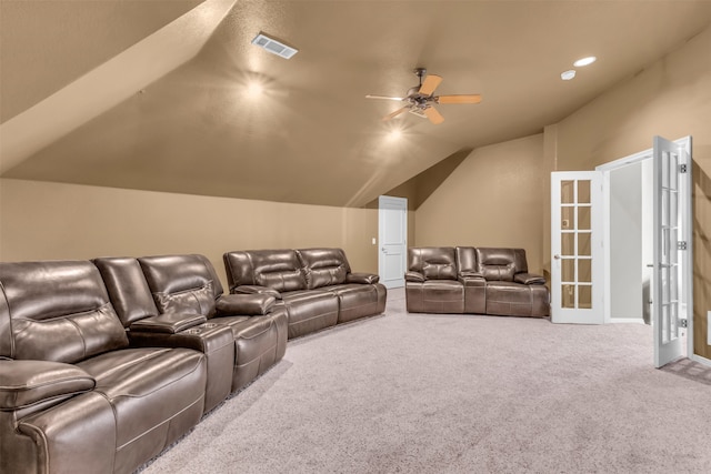 carpeted living room with ceiling fan, french doors, and lofted ceiling