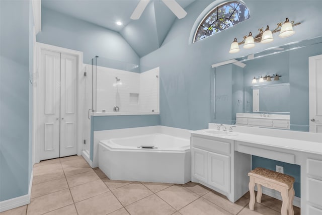 bathroom featuring tile patterned floors, vanity, and a bath