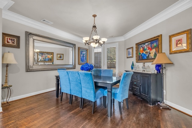 dining area with a chandelier, ornamental molding, and dark wood-type flooring