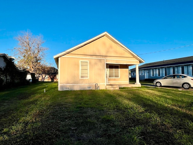 view of home's exterior with a yard