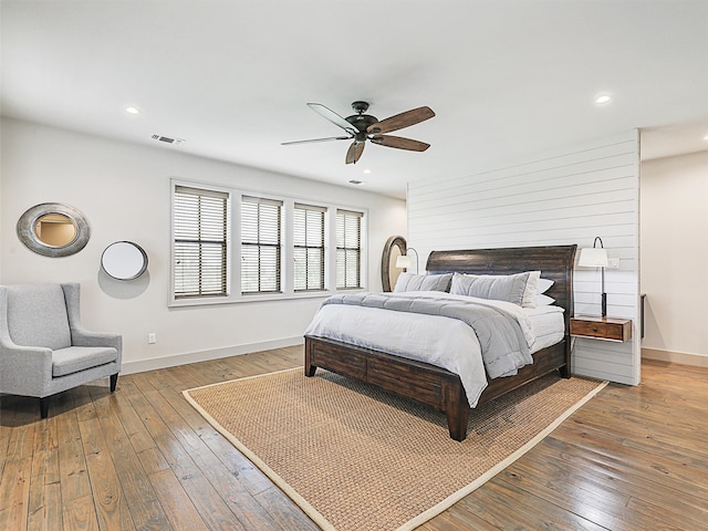 bedroom featuring ceiling fan and hardwood / wood-style floors