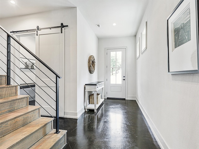 foyer entrance featuring a barn door