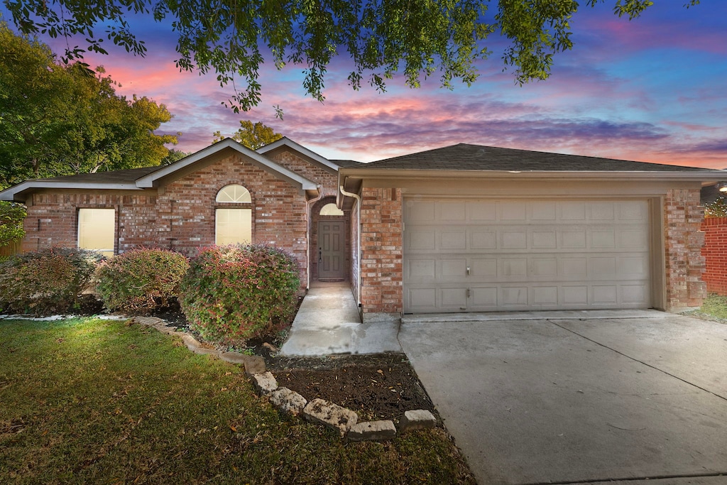 ranch-style house featuring a garage