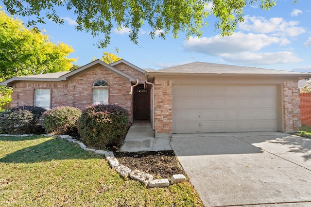 single story home with a garage and a front lawn