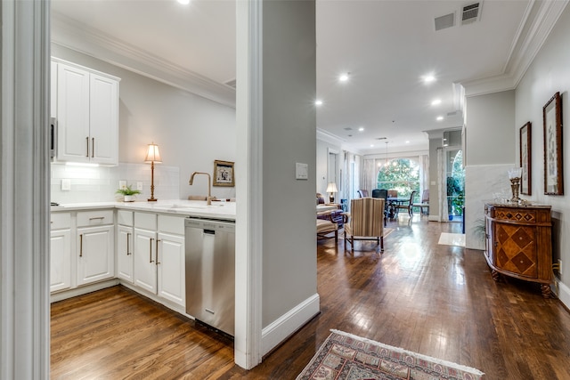 kitchen with dishwasher, hardwood / wood-style flooring, white cabinetry, and sink