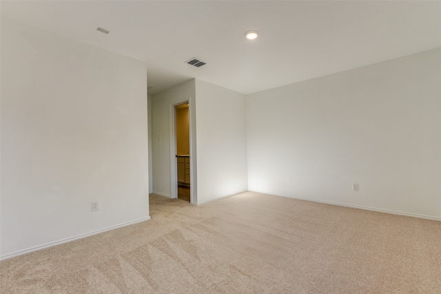 empty room featuring light colored carpet