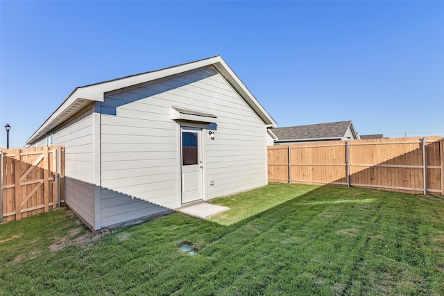 rear view of house with a lawn