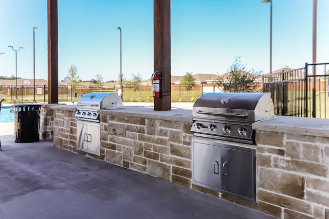 view of patio featuring area for grilling and exterior kitchen