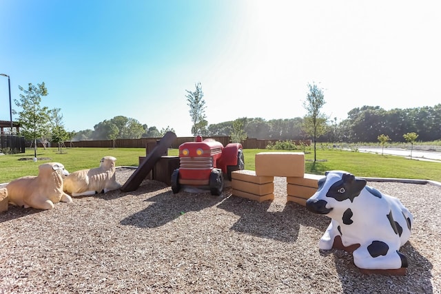 view of play area featuring a lawn