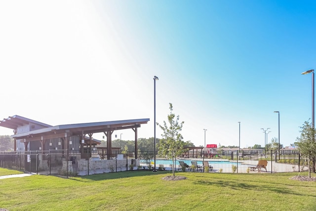 surrounding community featuring a yard and a pool