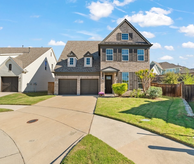 view of front of house featuring a front yard and a garage