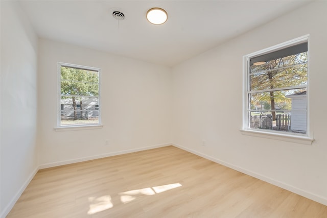 unfurnished room featuring light wood-type flooring