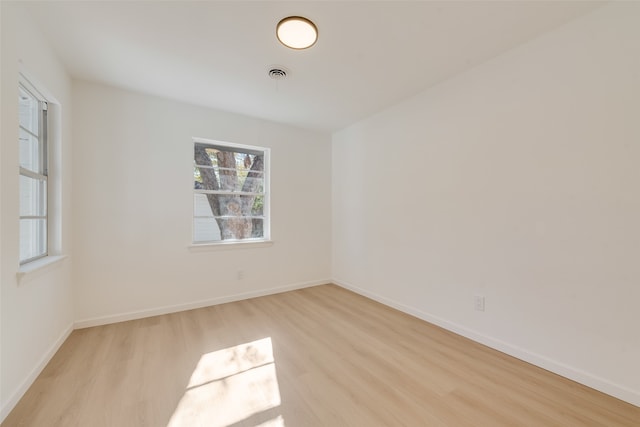 unfurnished room with light hardwood / wood-style flooring