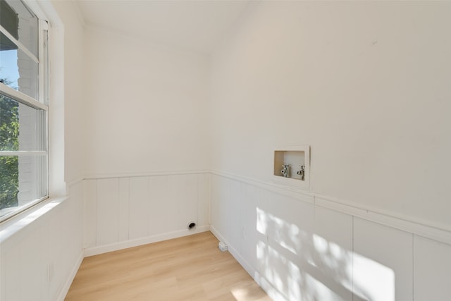 laundry room featuring light hardwood / wood-style floors and hookup for a washing machine