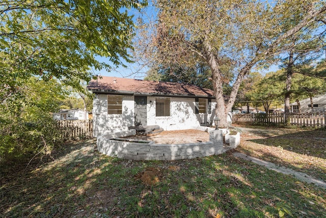 back of house with a yard