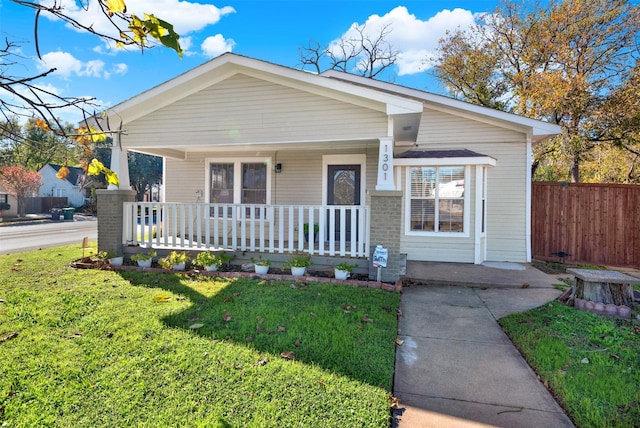 view of front of home featuring a front lawn and a porch