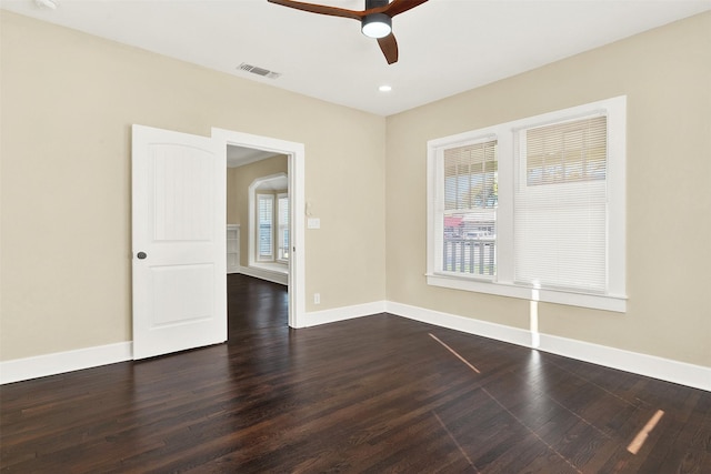 unfurnished room with dark wood-type flooring and ceiling fan