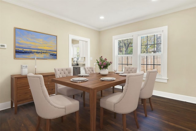 dining area featuring ornamental molding, dark hardwood / wood-style floors, and sink