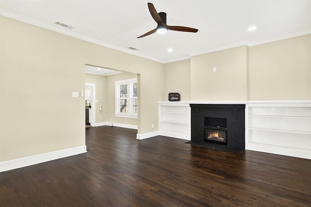 unfurnished living room featuring crown molding, dark hardwood / wood-style floors, and a fireplace