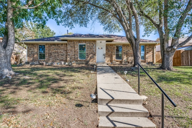 ranch-style home with a front yard