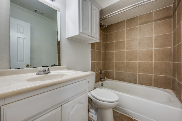 full bathroom featuring toilet, vanity, and tiled shower / bath