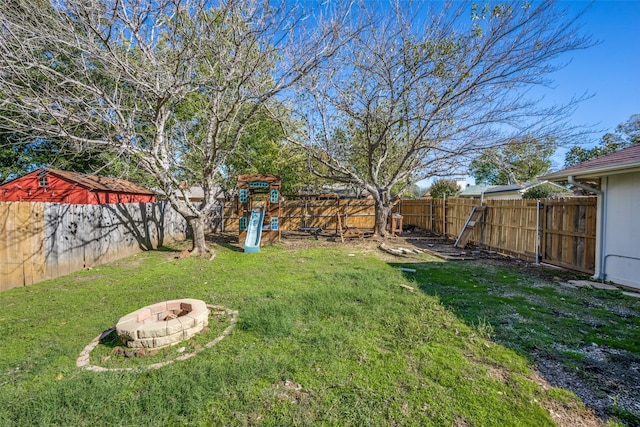 view of yard with an outdoor fire pit