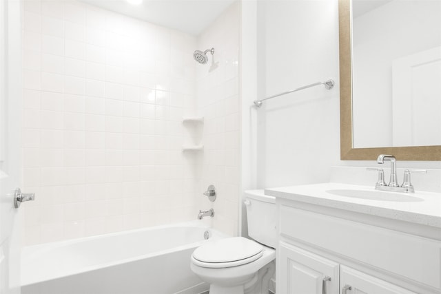 bathroom with toilet, vanity, and  shower combination