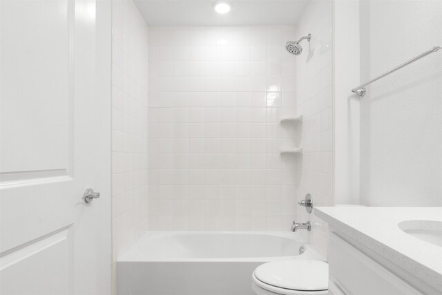 full bath featuring tub / shower combination, toilet, and vanity