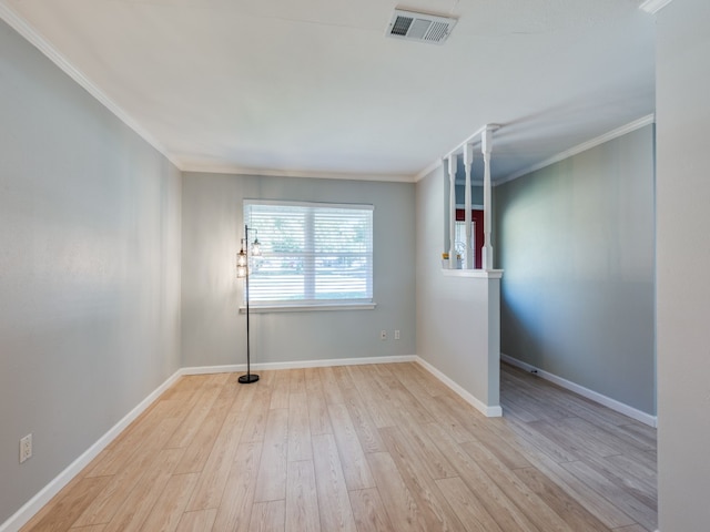 unfurnished room with crown molding and light hardwood / wood-style flooring