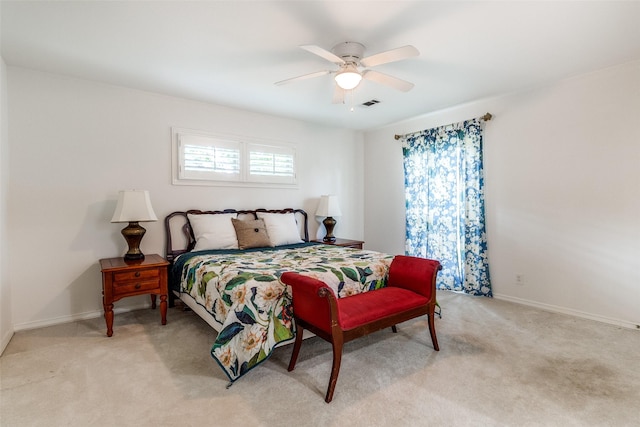 bedroom featuring ceiling fan and light colored carpet