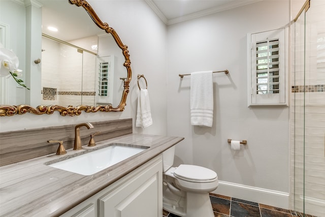 bathroom featuring vanity, a shower with door, tile patterned floors, toilet, and ornamental molding