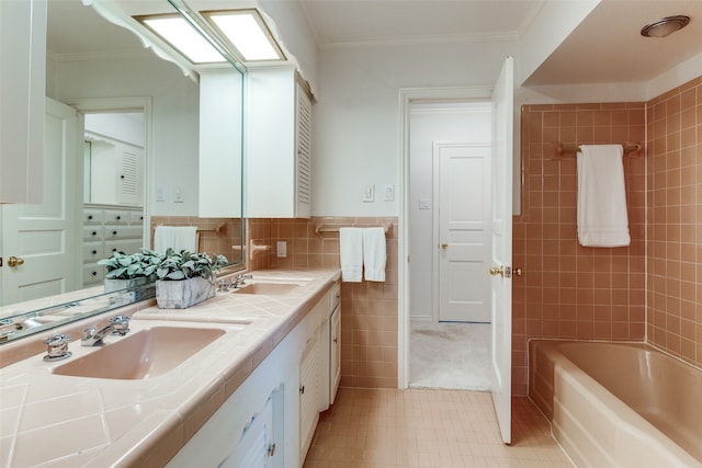 bathroom with vanity, tile walls, and ornamental molding